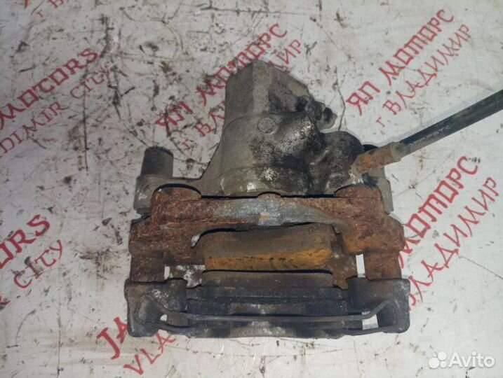 Суппорт тормозной задний левый Mazda 3 Bl седан ZY