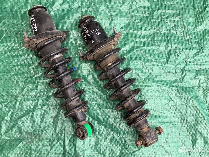 Стойка амортизатора задняя Avensis 250