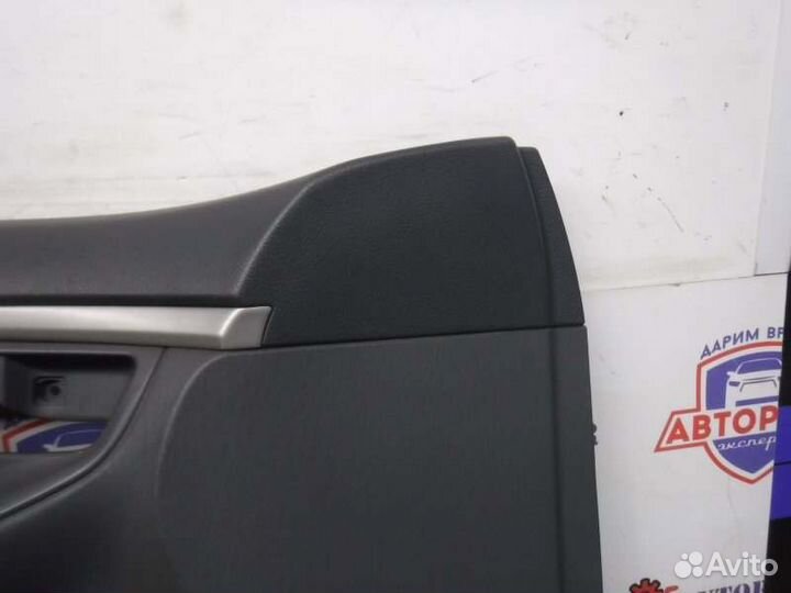 Обшивка двери передняя левая Toyota Corolla 124