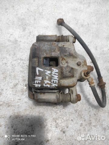 Суппорт тормозной передний Nissan Almera n15