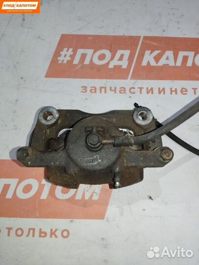 Суппорт тормозной передний левый Nissan X-Trail