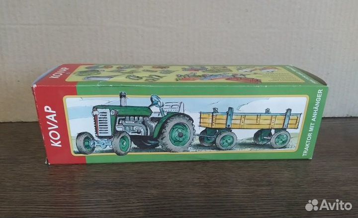 Игрушка kovap трактор с прицепом. Коробка