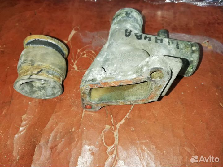 Патрубок отводящий Нива Шевроле