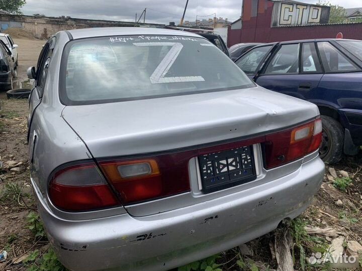 Бампер задний Mazda Familia 1998-2004