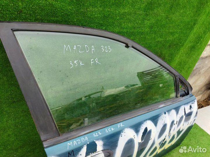 Стекло двери опускное переднее правое Mazda 323 BA