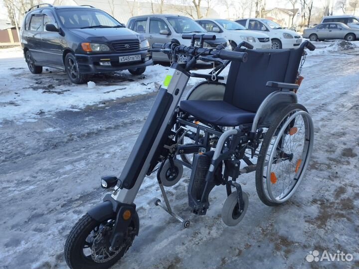 Электрическая приставка с инвалидной коляской