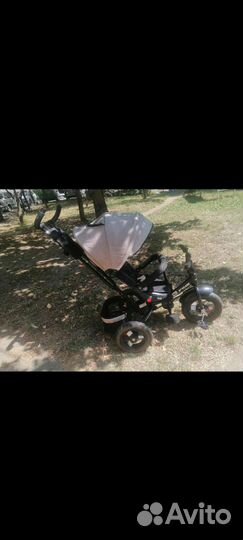 Детский трехколесный велосипед с поворотом сидения