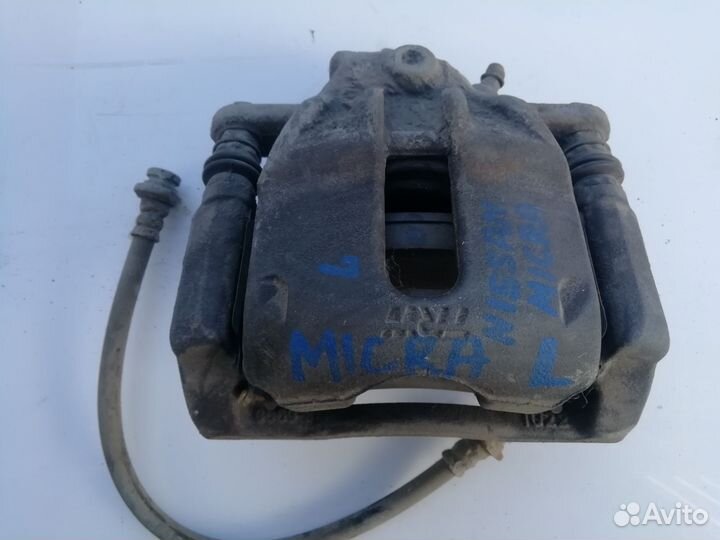 Суппорт передний левый Ниссан Микра К12