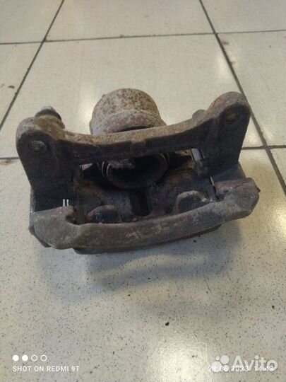 Суппорт тормозной передний левый Kia Picanto 2