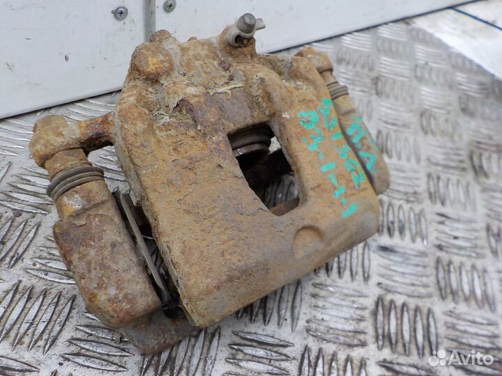 Суппорт тормозной передний левый Kia Rio 2011