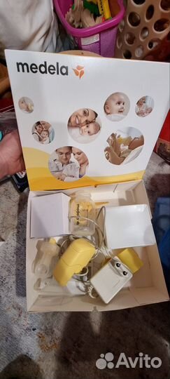 Молокоотсос medela электрический