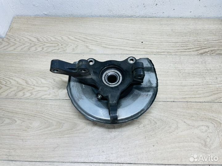 Кулак левый передний Mitsubishi Lancer 10