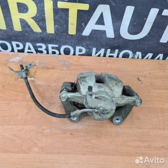 Суппорт тормозной передний левый Kia Sportage 5