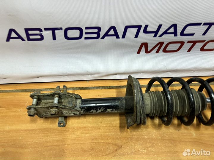 Mazda CX-7 передняя стойка амортизатора левая
