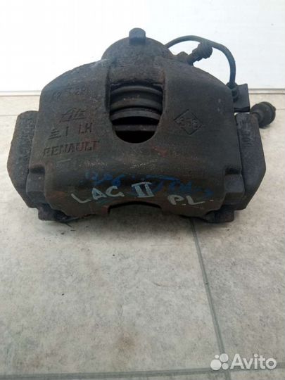 Суппорт тормозной передний левый Renault Laguna 2