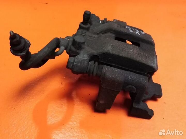 Суппорт тормозной задний левый Nissan Pathfinder