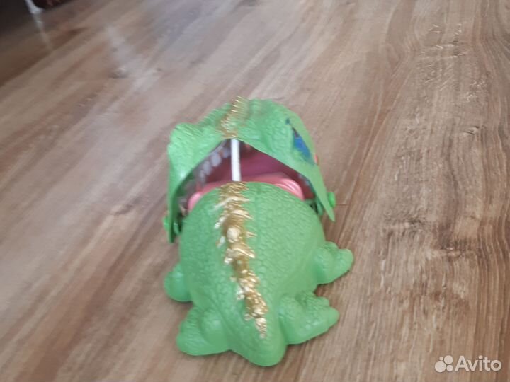Динозавр игрушка нажимать на зубчики