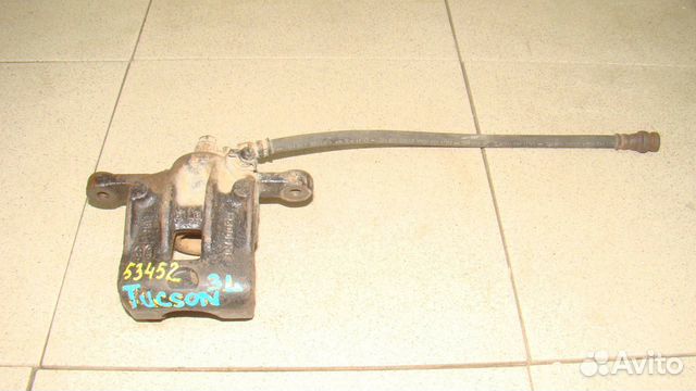 Суппорт задний левый Hyundai Tucson 1 (JM)