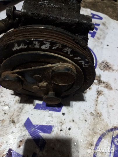 Компрессор кондиционера Mazda 323