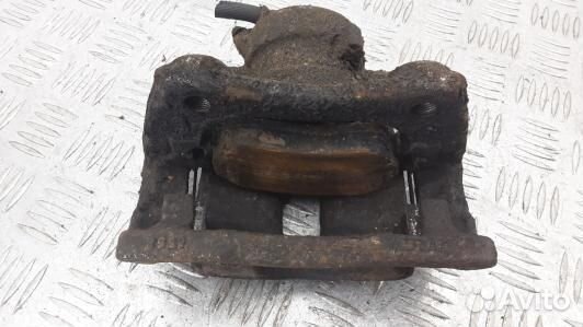 Суппорт тормозной передний левый nissan note E11