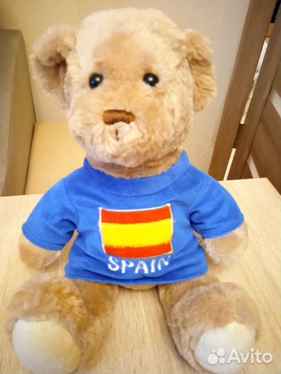 Плюшевый медведь музыкальный