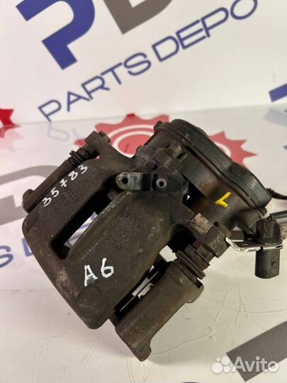 Суппорт тормозной задний левый Audi A6 Avant C7