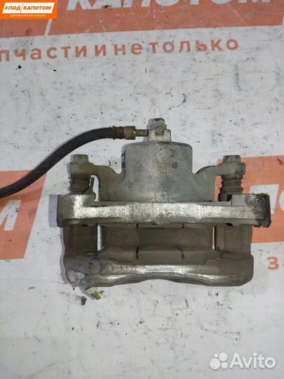 Суппорт тормозной передний левый Nissan Teana J32