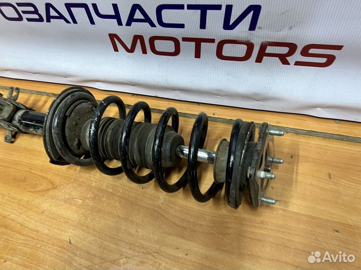 Mazda CX-7 передняя стойка амортизатора левая