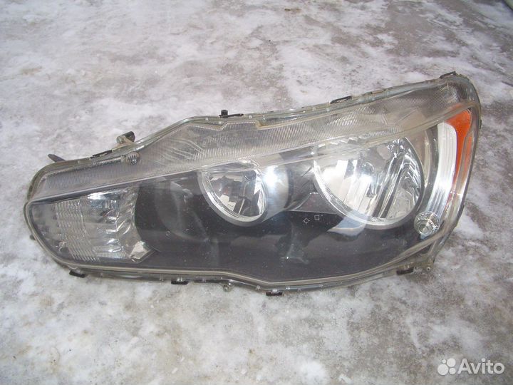 Фара левая Митсубиси Ланцер 10 с07-17г