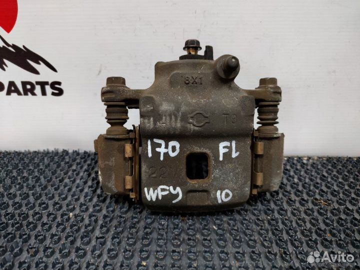 Суппорт тормозной передний левый Nissan Wingroad