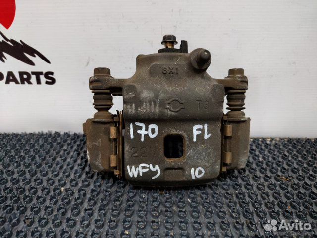 Суппорт тормозной передний левый Nissan Wingroad