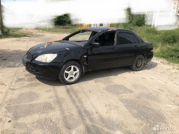 В разборе Mitsubishi Lancer 9 лансер 4g18 1.6