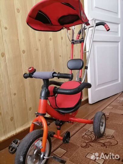 Трехколесный велосипед с ручкой