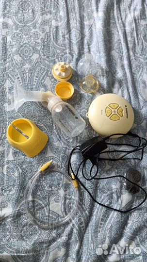 Молокоотсос medela электрический