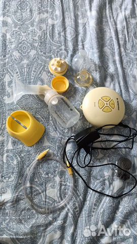Молокоотсос medela электрический