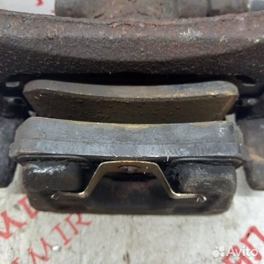 Суппорт тормозной задний левый Mitsubishi Lancer