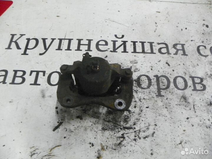 Суппорт тормозной передний левый Kia Sportage