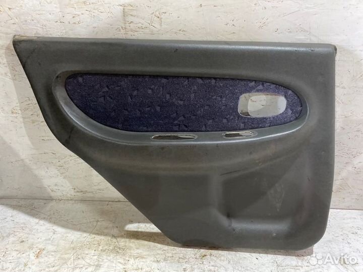Обшивка боковой двери задняя левая Kia Spectra