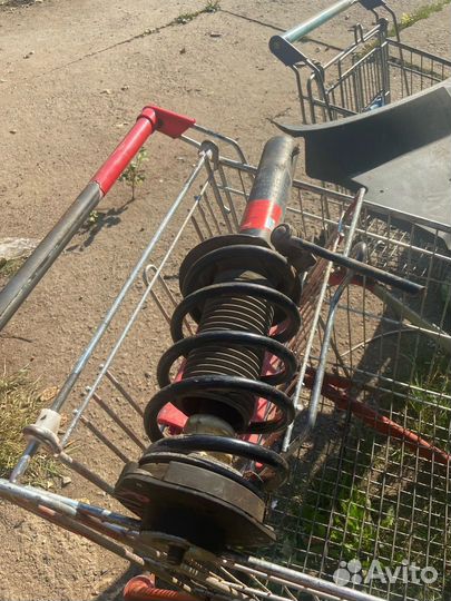 Стойка передняя Фольксваген Пассат б6