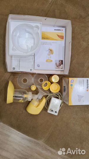 Молокоотсос medela и насадки новые