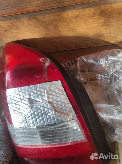 Фонарь Nissan primera p12 с дефектом левый