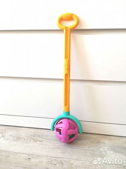 Игрушка каталка с ручкой