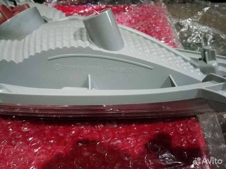 92305M6000 фонарь задний в бампер левый новый