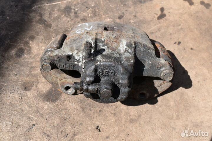 Суппорт тормозной передний левый Mitsubishi Lancer