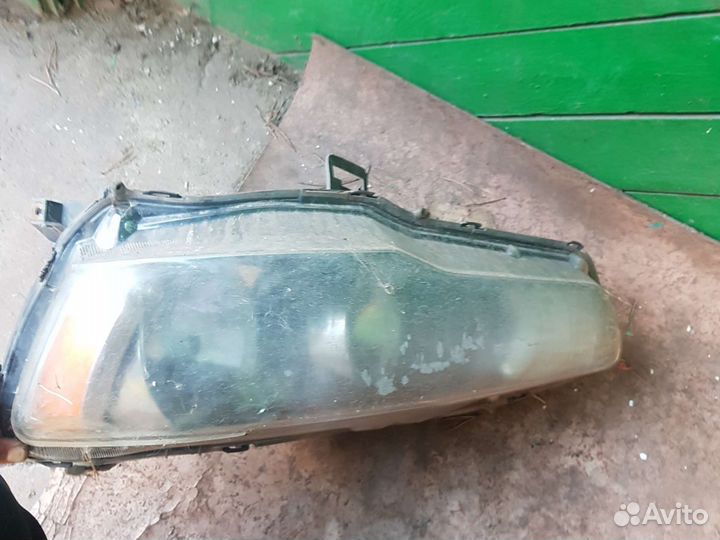 Фара левая lancer 10
