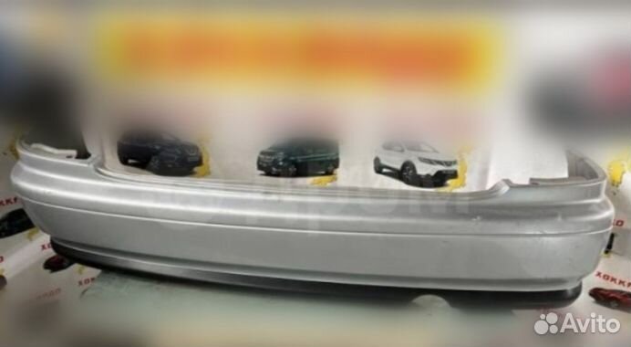 Задний бампер Mazda Familia