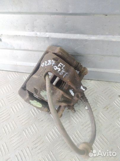 Суппорт тормозной передний левый Renault Duster