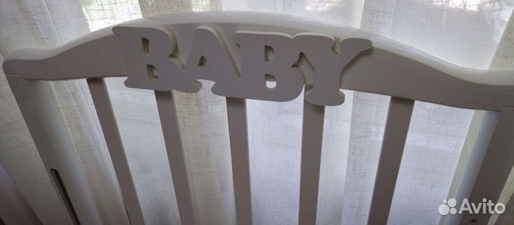 Детская кроватка с продольным маятником