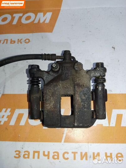 Суппорт тормозной задний левый Nissan X-Trail T31