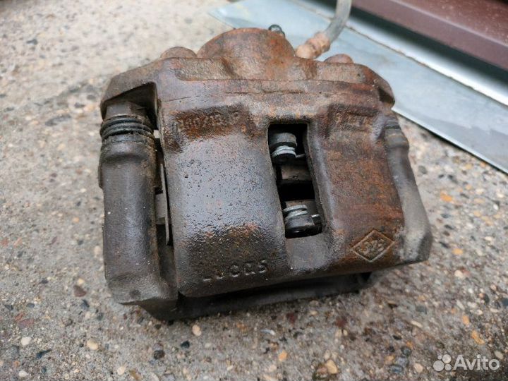 Суппорт тормозной передний Renault Logan седан K7J